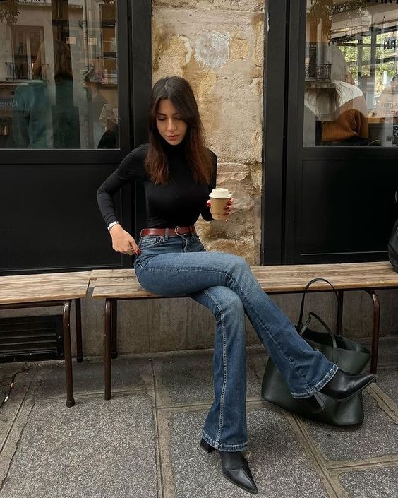 Black Turtleneck with Dark Blue Flared Jeans and Black Boots 